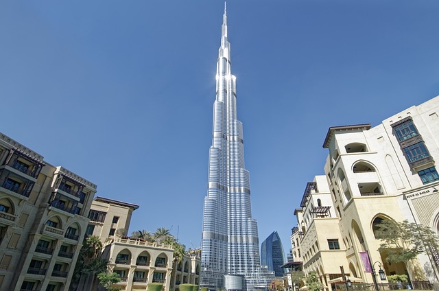 Burj Khalifa towering in Dubai against a vivid blue sky,