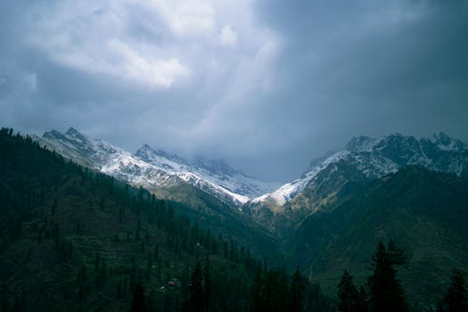 Scenic view of the dramatic and snowcapped mountains in Manali, India.