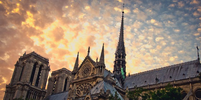 Captivating sunset over Notre-Dame Cathedral in Paris, highlighting Gothic architecture.