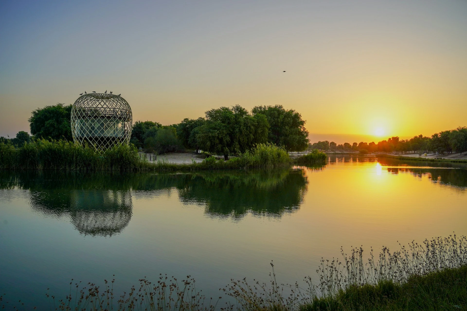 Love Lake at sunrise in Dubai UAE, a popular outdoor tourist attraction and photography spot surrounded by heart shaped lake formations in Al Qudra desert