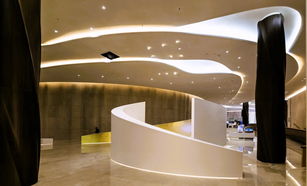 Etihad Museum Dubai: Tickets, Timings and What to See 2 Inside the Etihad Museum lobby with curved walls and dark columns