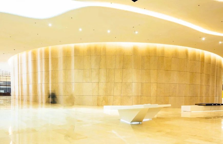 Etihad Museum Dubai: Tickets, Timings and What to See 3 Etihad Museum interior hall with a curved gold wall