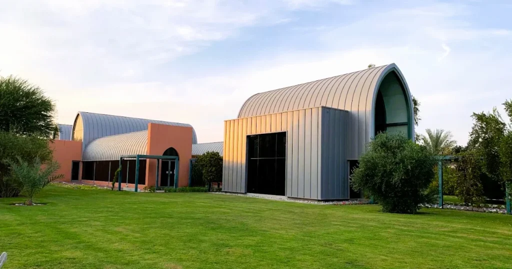 Islamic Botanical Garden in Sharjah: Plants of the Quran, Timings and Visit Guide 3 Modern curved buildings and lawns at the Islamic Botanical Garden in Sharjah Desert Park
