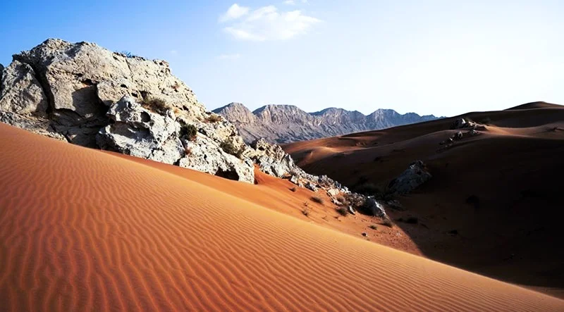 Mleiha Desert in Sharjah: Dunes, Stargazing, Camping and Where to Stay 4 Limestone rocks and red sand dunes in the Mleiha desert