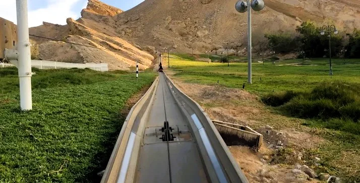 Mini Train Hot Spring in Al Ain, Abu Dhabi: Tickets, Timings and Tips 2 Mini train hot spring rail track winding through the Jebel Hafeet foothills at Green Mubazzarah, Al Ain