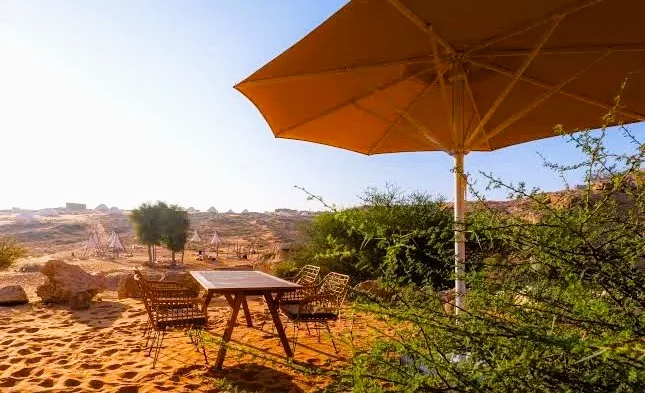 Mleiha Glamping in Sharjah: Tents, Season, Activities and Tips 3 Shaded outdoor seating in the desert at Mleiha glamping