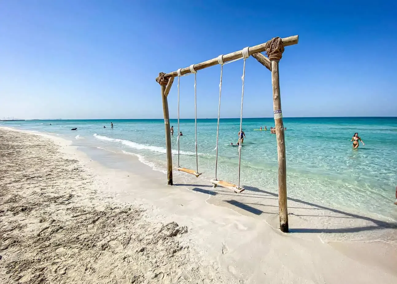 Beaches in Umm Al Quwain: Best Spots, Resorts and Tips 3 Beaches in Umm Al Quwain: family beach, kitesurfing and mangrove island scenes
