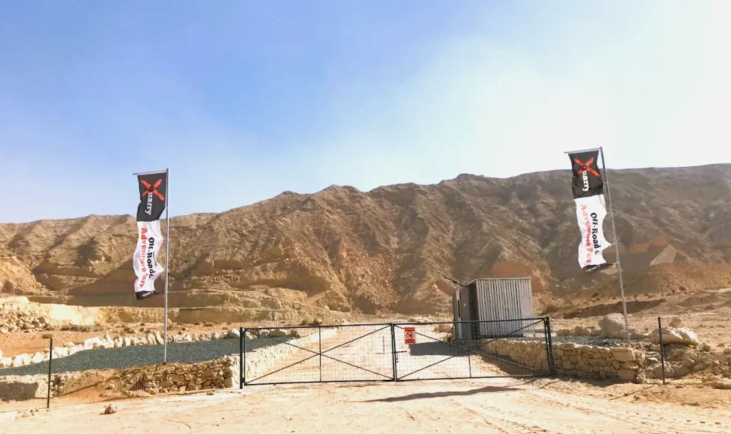 XQuarry Adventure Park Sharjah: Off Road Tracks, Camping and Visitor Guide 3 XQuarry Adventure Park entrance gate with flags below Al Faya Mountain